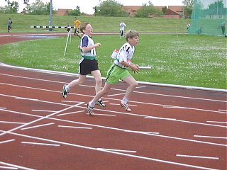 Stephen Brennan hands to Jamie Wilson U13 4x100m